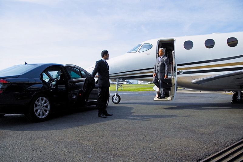 Luxury airport transfer service in Houston with professional chauffeur and premium vehicle