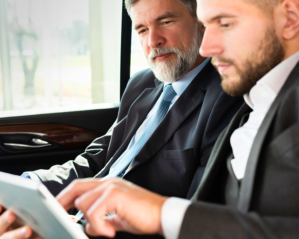 Professional chauffeur driving a luxury vehicle for C&S Executive transportation services