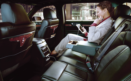 Interior of a luxury sedan showcasing comfortable seating and premium amenities