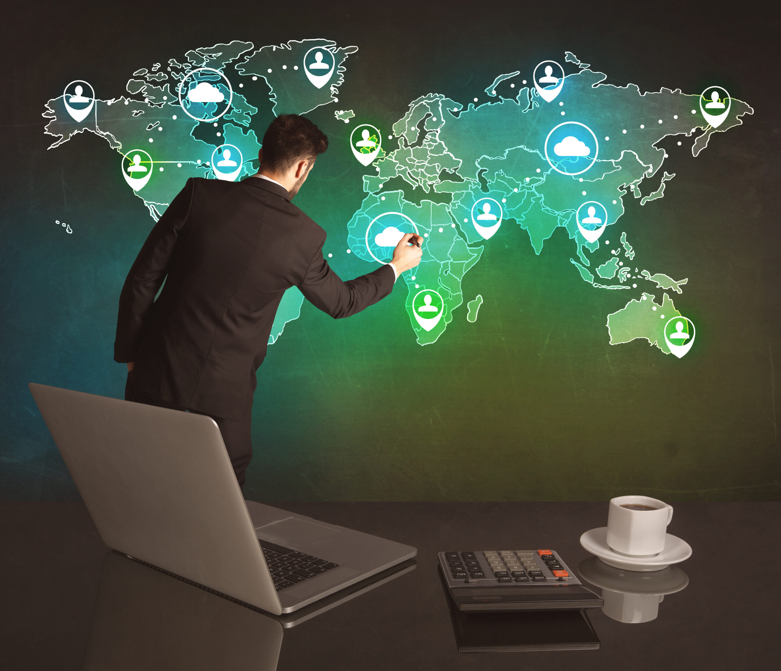 Worldwide-Ground-Transportation-Global-Limo-Service Businessman interacting with a world map representing CNS Limo’s global chauffeur network.